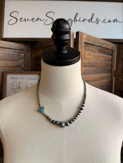 Silver-tone beaded necklace with turquoise cowhead charm and small drops