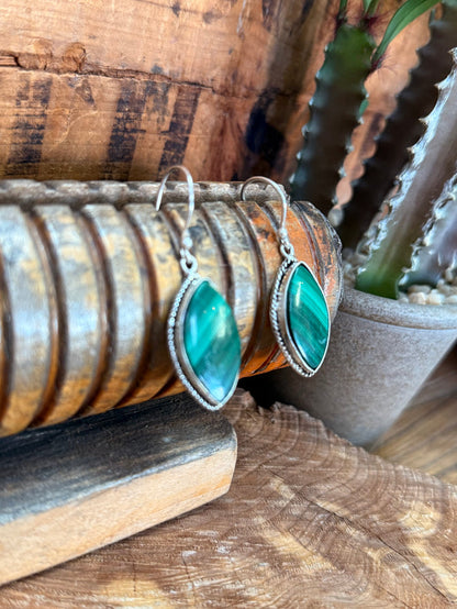 Silver-tone fishhook earrings with teal oval malachite stone teardrop frames