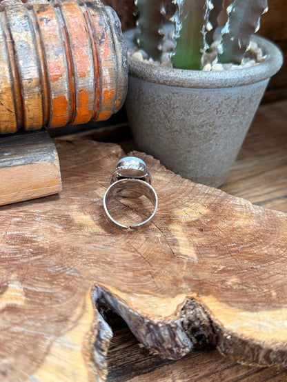 Silver-tone adjustable ring band with oval blue stone top