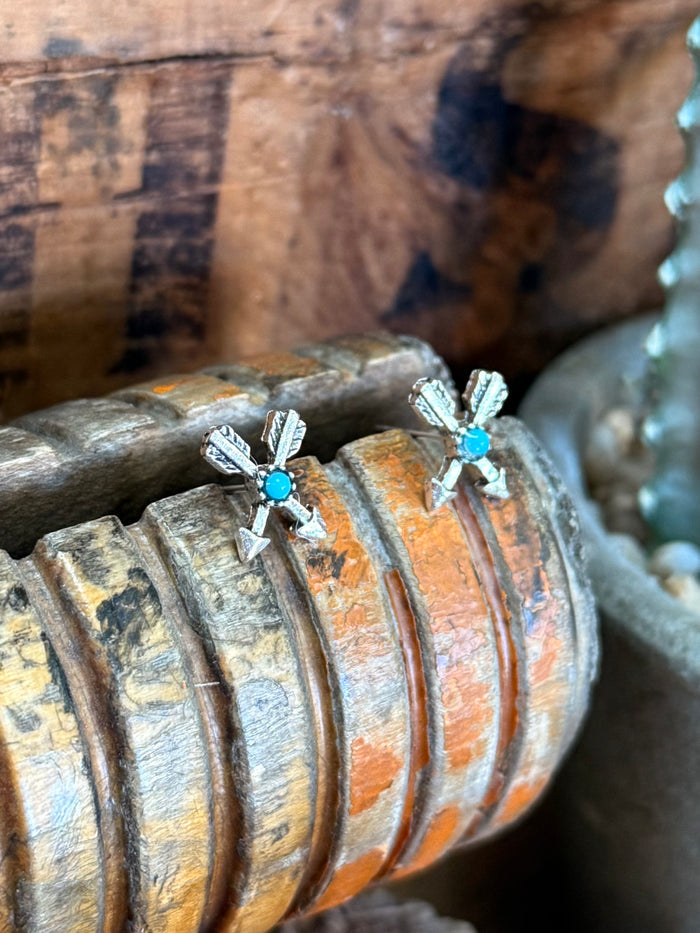 Silver arrow stud earrings with turquoise cabochon stones and arrowburst detail