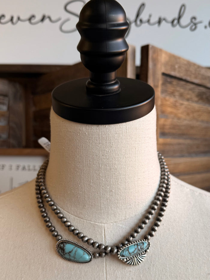 Turquoise chunk necklace with layered silver-tone bead chain and two oval turquoise charms