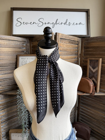 Polka dot wild rag scarf in black with white dots, tied at the neck