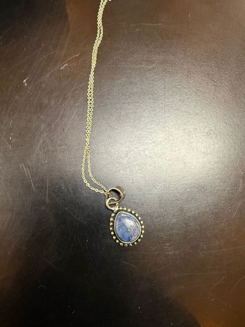 Silver-plated brass necklace with gold chain and oval blue lapis pendant