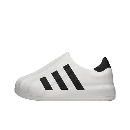 White sock-style sneaker with black adidas stripes, low profile sole