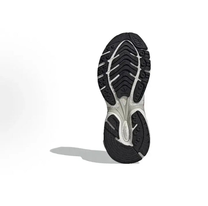 Adidas running sneakers outsole view, black tread with white midsole