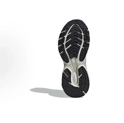 Adidas running sneakers outsole view, black tread with white midsole