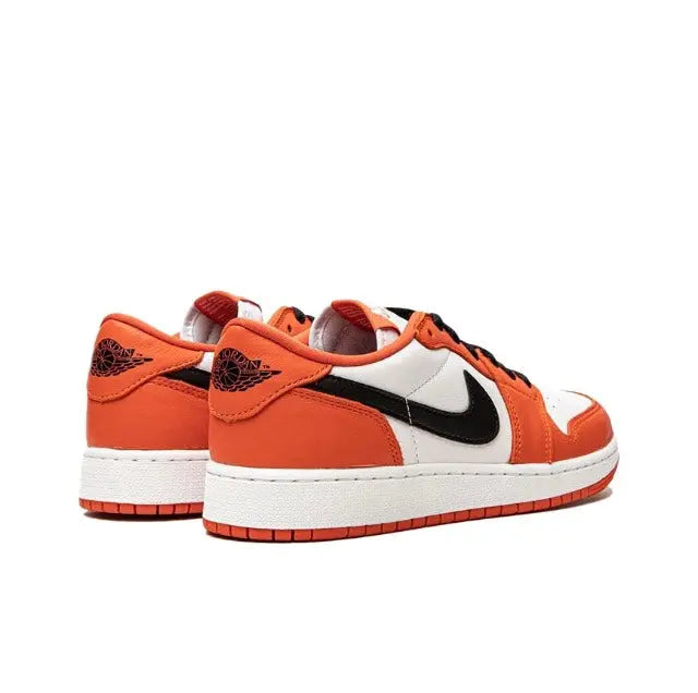 Nike Air Jordan 1 low-top sneaker in orange, white, and black with black Swoosh