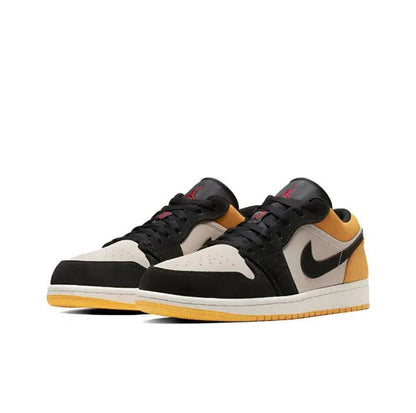 Air Jordan 1 low-top pair in black, sail, and gold with Nike swoosh