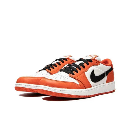 Nike Air Jordan 1 low-top sneaker in orange, white, and black with black lace-up