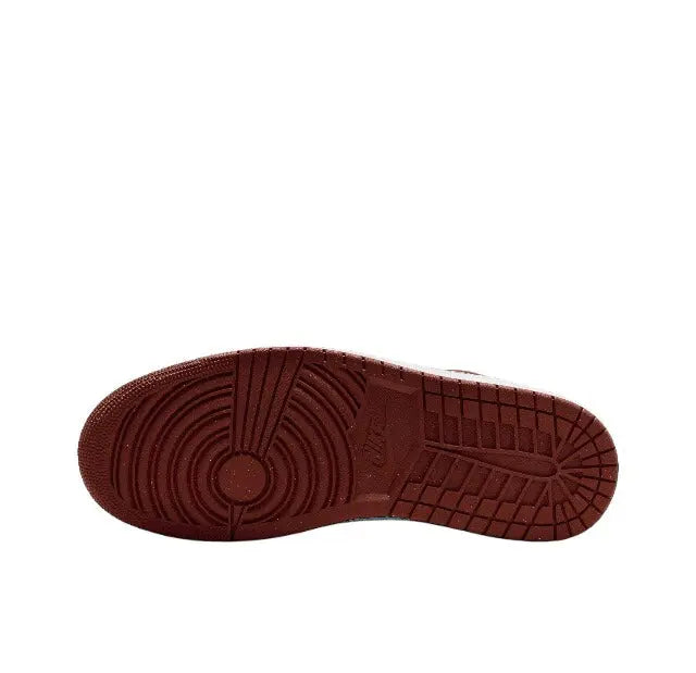 Low-top sneaker outsole in dark burgundy with tread detail