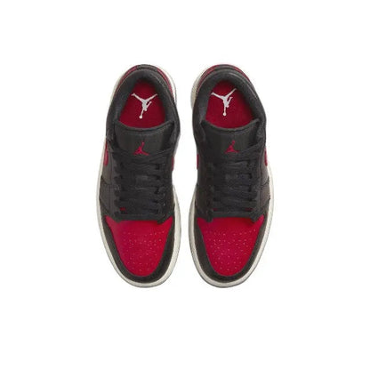 Air Jordan 1 low-top sneakers, black with red toe panels and Jumpman on tongue
