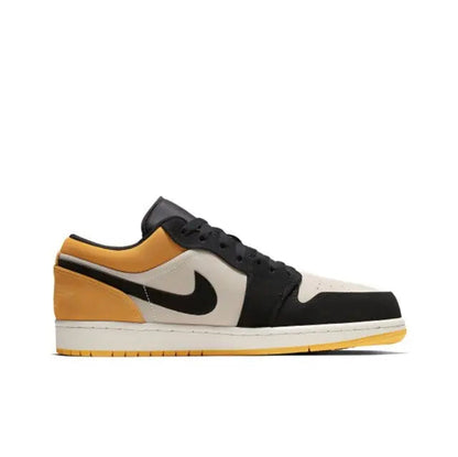 Air Jordan 1 side profile sneaker in black with sail panel and gold accents