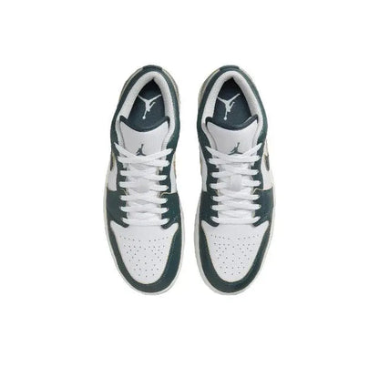Low-top sneaker top view in white with dark green lining and lace-up