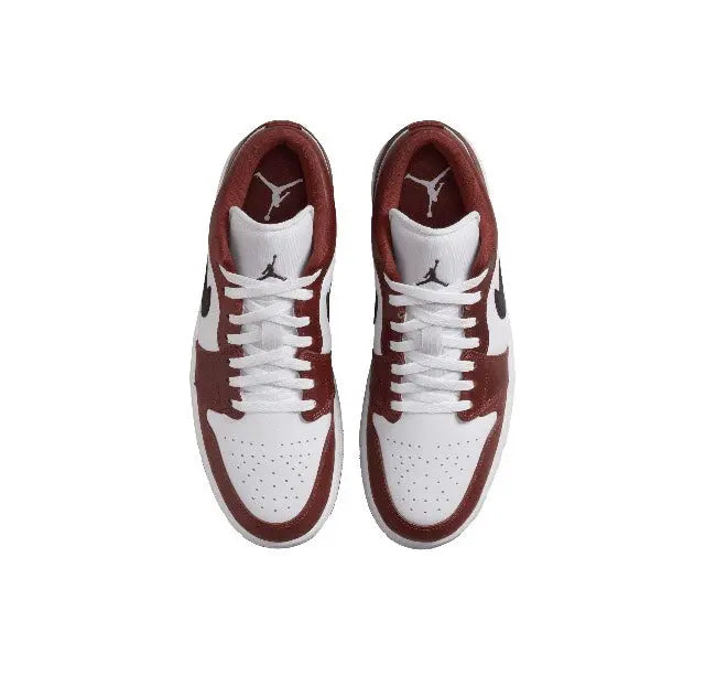 Low-top sneakers pair, white laces with burgundy toe and side