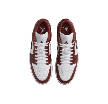 Low-top sneakers pair, white laces with burgundy toe and side