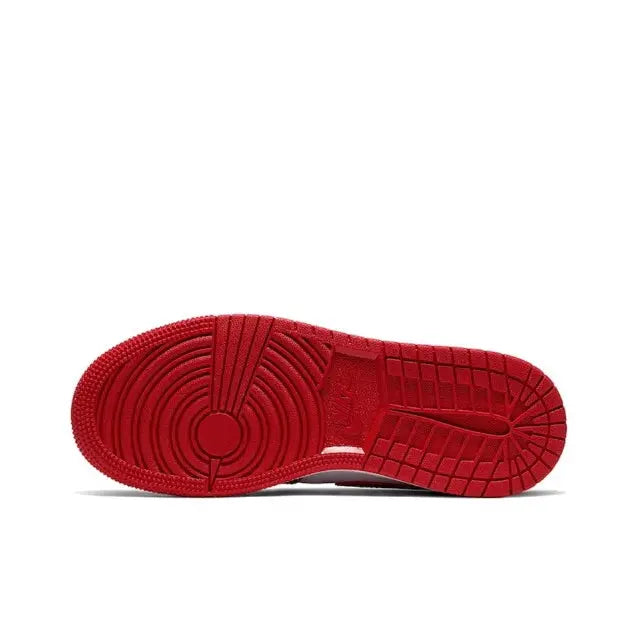 Red rubber outsole with tread grooves and raised traction blocks