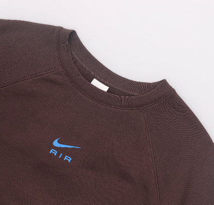 Fleece crewneck sweatshirt close-up: ribbed collar and Air logo