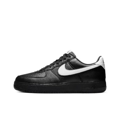 Black low-top sneaker with white Nike swoosh and lace-up front