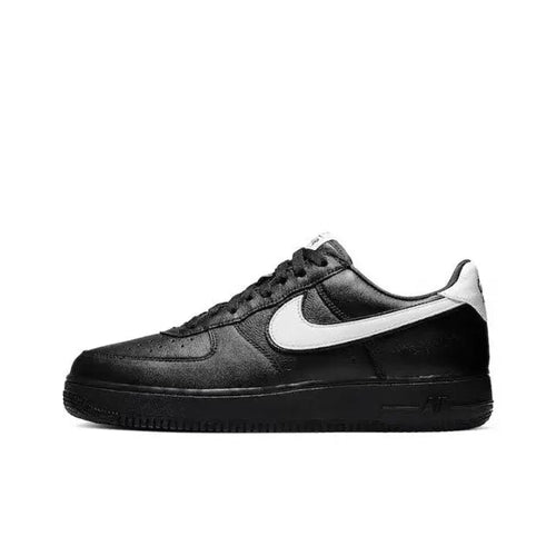 Black low-top sneaker with white Nike swoosh and lace-up front
