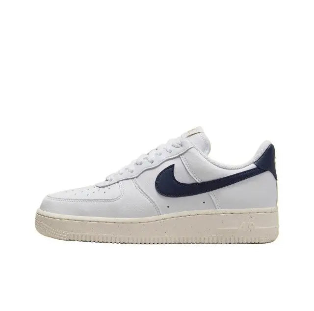 Nike Air Force 1 low-top sneakers in white with navy swoosh and off-white sole