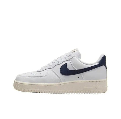 Nike Air Force 1 low-top sneakers in white with navy swoosh and off-white sole