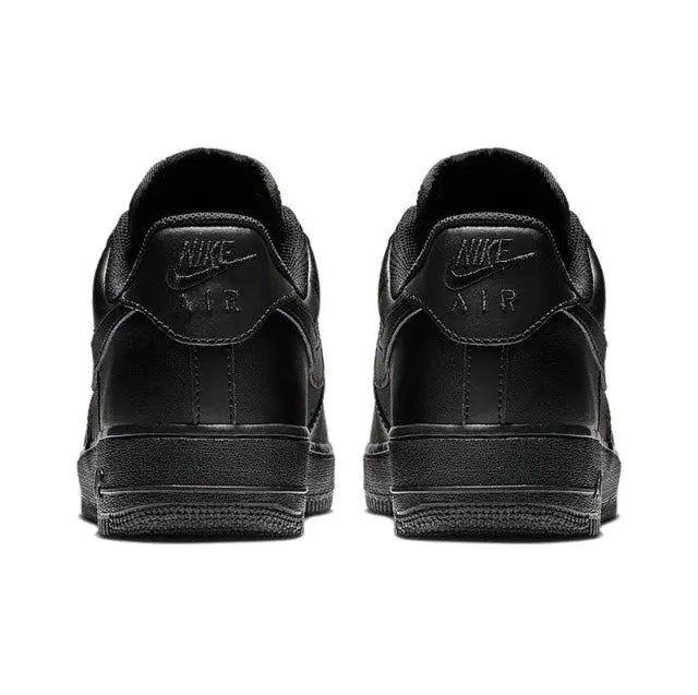Black low-top sneaker heel pair with padded collar and Nike branding on the back