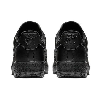 Black low-top sneaker heel pair with padded collar and Nike branding on the back