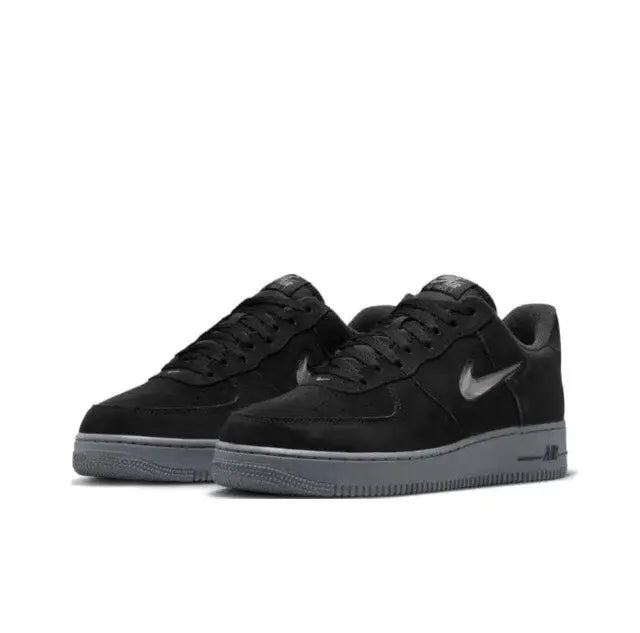 Nike Air Force 1 '07 Low sneakers, black leather with grey sole, front angle