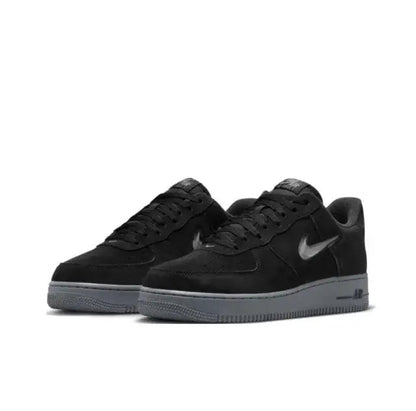 Nike Air Force 1 '07 Low sneakers, black leather with grey sole, front angle