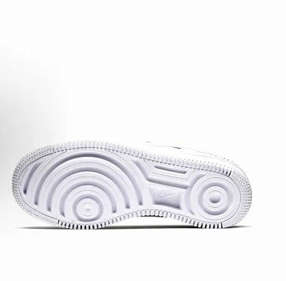 White rubber outsole with circular traction patterns and ribbed tread
