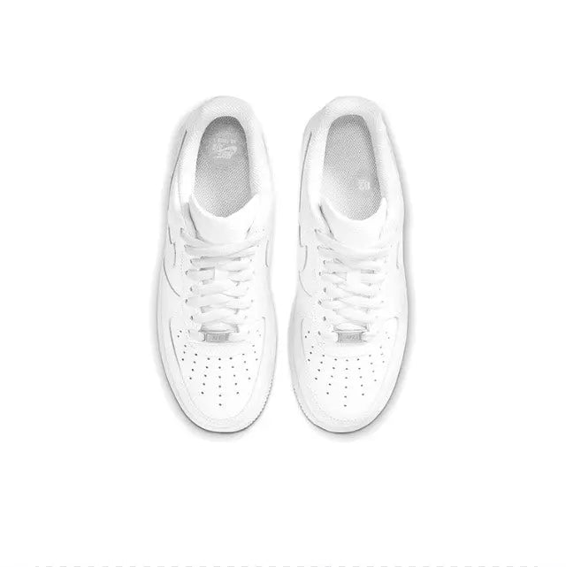 White Nike Air Force 1 low sneakers, top view showing laces and perforated toe box
