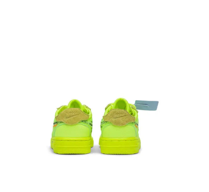 Lime green low-top sneaker back view with blue pull tab