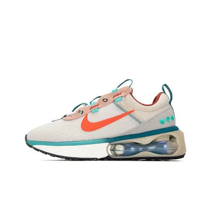 Light sneakers with orange Nike swoosh, teal accents, and visible Air Max window