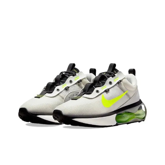 Nike running sneaker pair, off-white with neon green accents and black lace trims