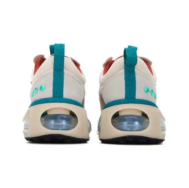 Light sneakers with teal heel strap and Air Max window, rear view