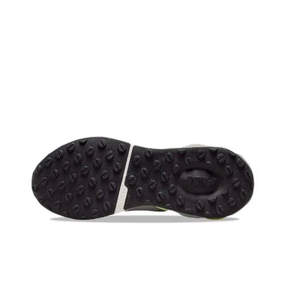 Nike running sneaker outsole, dark tread with raised rubber pods