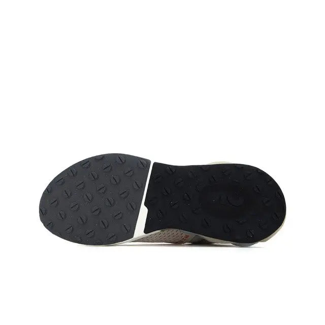 Black rubber outsole with textured traction pattern for sneakers