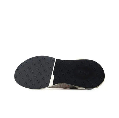 Black rubber outsole with textured traction pattern for sneakers