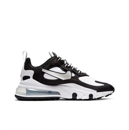 Low-top sneakers side view in white with black overlays and clear air unit