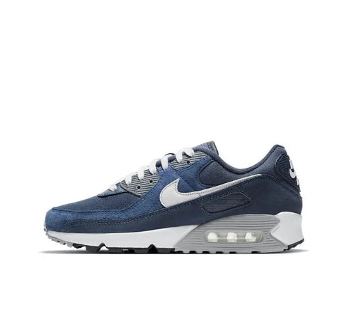 Low-top sneakers in dark blue with white swoosh and visible Air Max sole unit