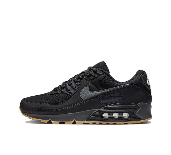 Nike Air Max 90 sneakers in black with gray swoosh and visible air unit