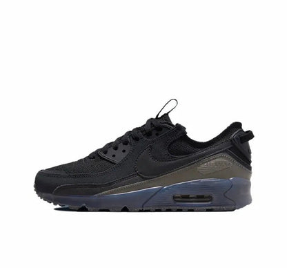 Nike Air Max 90 sneakers in black with gray overlays and blue visible Air unit