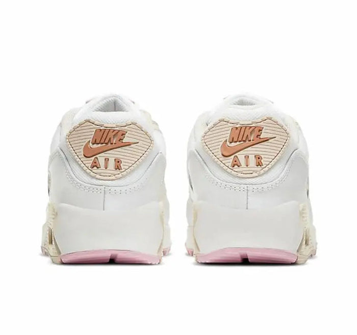 Nike Air Max 90 low-top sneakers, heel view, white with pink trim and Air logo