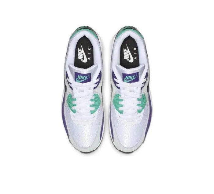 Pair of white low-top sneakers with teal accents, purple collar, and Nike Air text