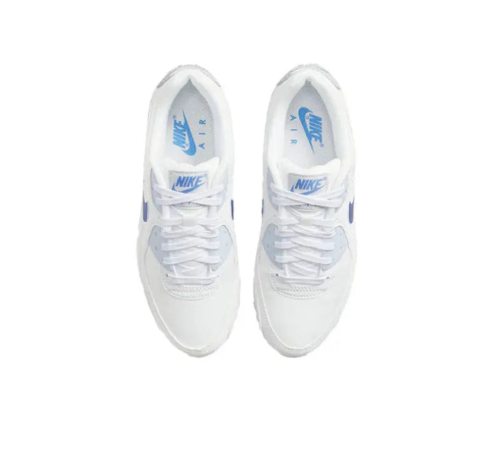 White low-top sneakers with blue tongue logo and lace-up system