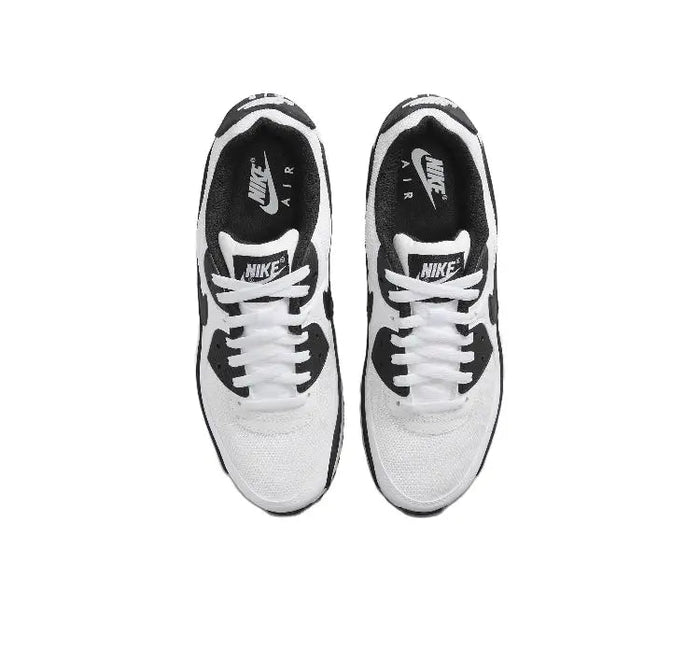 Air Max 90 sneaker top view, white laces with black Nike and Air heel tags