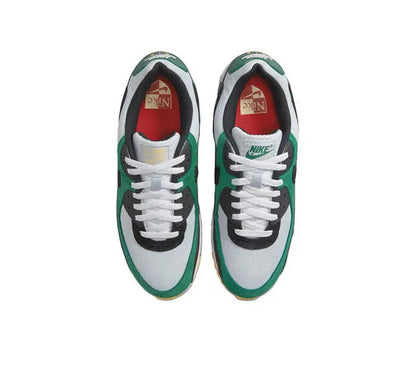 Nike Air Max 90 sneaker pair, white laces and toe with green side panels and black accents