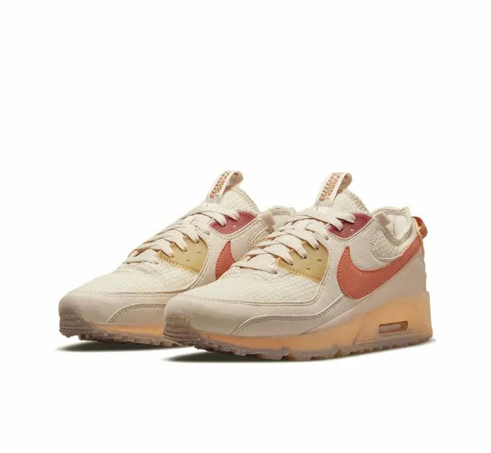 Air Max 90 sneaker, light tan upper with orange Swoosh and visible air unit