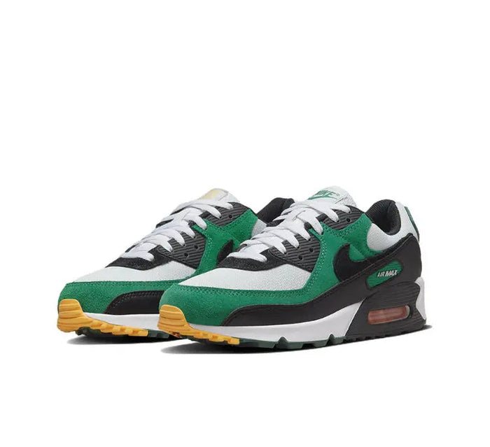 Nike Air Max 90 sneaker pair, green-and-white upper with black midsole and orange air unit