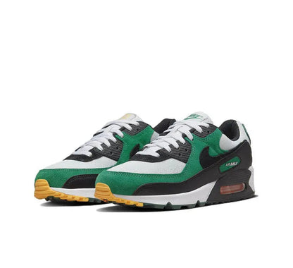 Nike Air Max 90 sneaker pair, green-and-white upper with black midsole and orange air unit